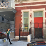 The 122CC building on 9th street and first avenue: the building is painted red, with teal window trims. 