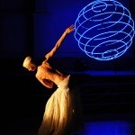 dancer silouhette with blue sphere