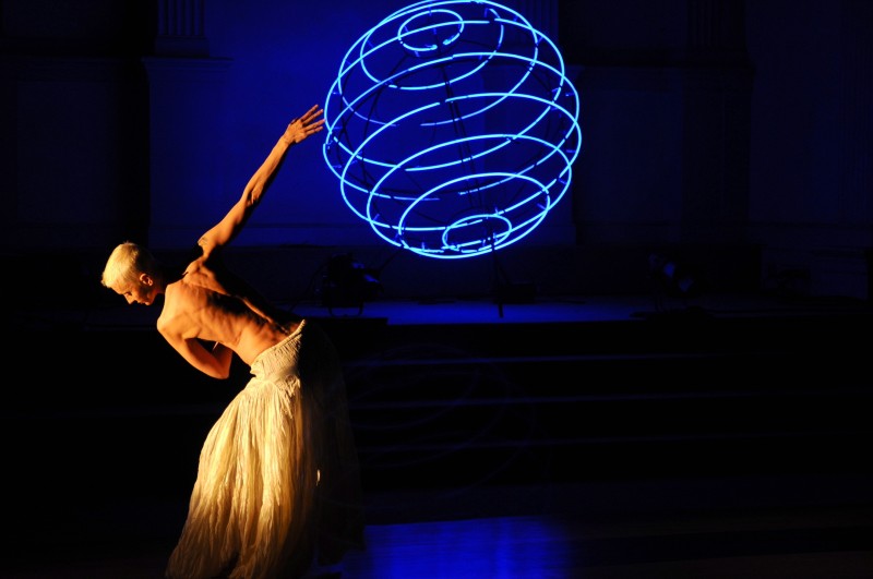 dancer silouhette with blue sphere