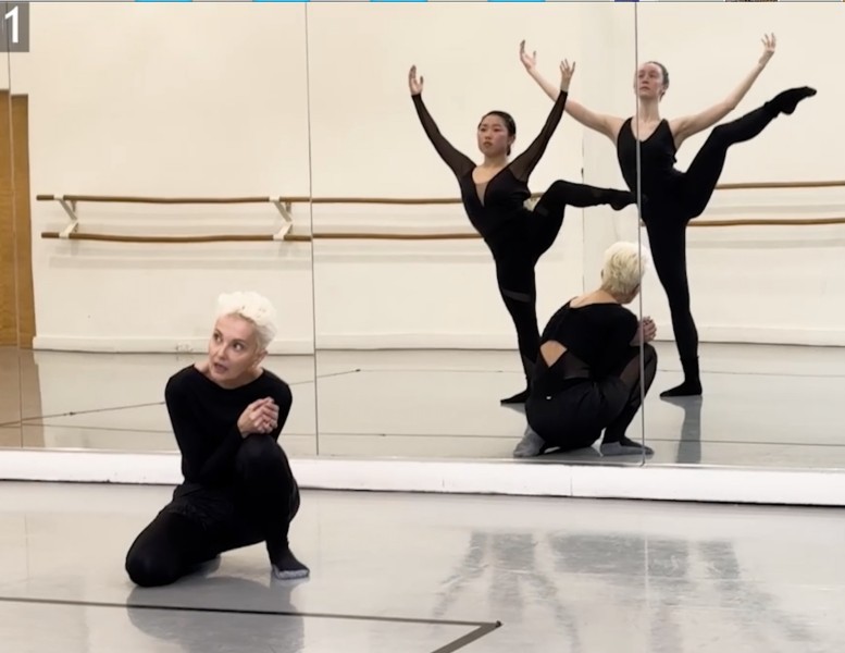 reflection of 3 dancers in a mirror