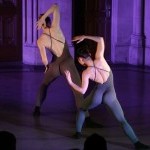 Two dancers back to the audience