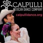 Two dancers in white costuming standing in front of a black background with the company logo hovering above.