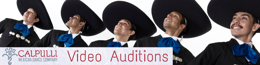 Male dancers in charro dress looking off into th distance