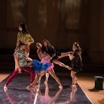 Dancers doing a lift on stage