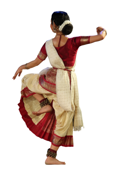 A woman wearing traditional Indian clothes dancing 