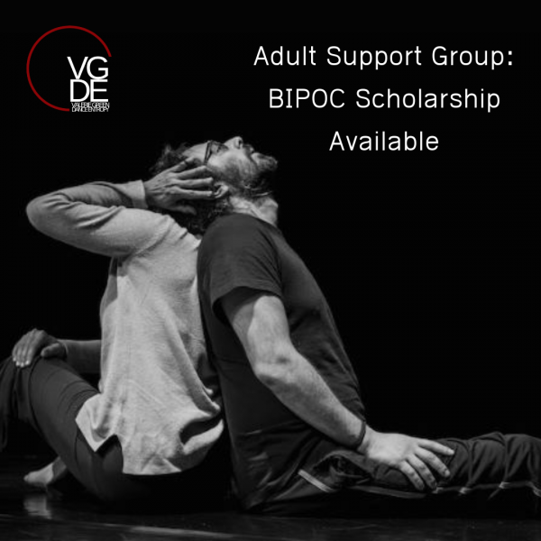 Two people sit back to back on the floor with the above text overlaid