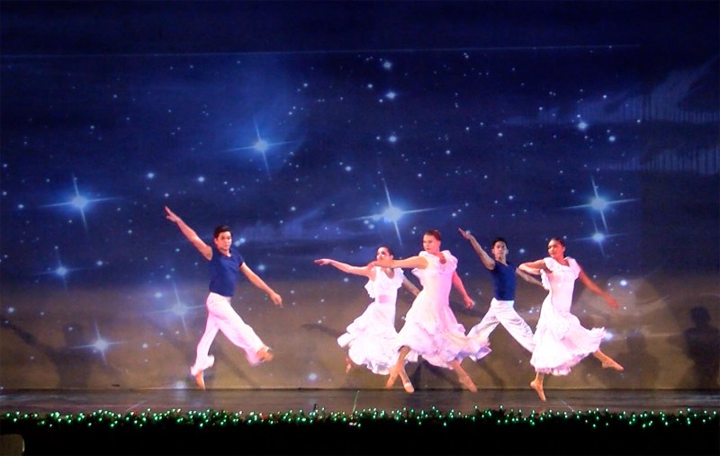 Promotional image of dancers performing for the Kennedy Dancers Bare Soles choreographers showcase during National Dance Week