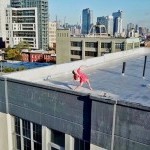 Dancer in red dress atop Brooklyn roof