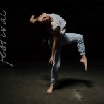 Dancer stands on right leg, left leg lifted with a bent knee, arched back towards the right side. 