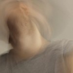 Blurred photo of a dancers upper body in motion