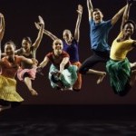 A photo of six people jumping in the air