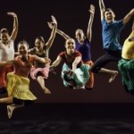 Photo of six dancers jumping in the air