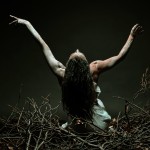 Gwendolyn Gussman dances in dirt and dead  branches