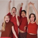 four people with arms up excited!