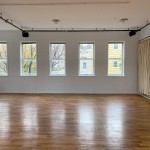 Photo of Douglas Elliman Rehearsal Studio with hardwood floors, white walls, full-length mirror, and lot’s of natural light.