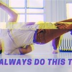 Evik, on the ground in a studio, reaches upward with one hand. The image is distorted, as if being displayed on a broken TV