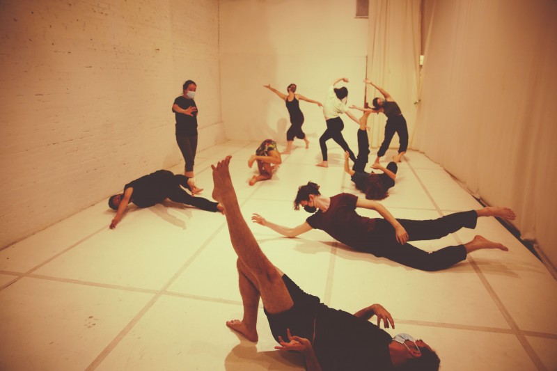Dancers Exercising in a White Studio