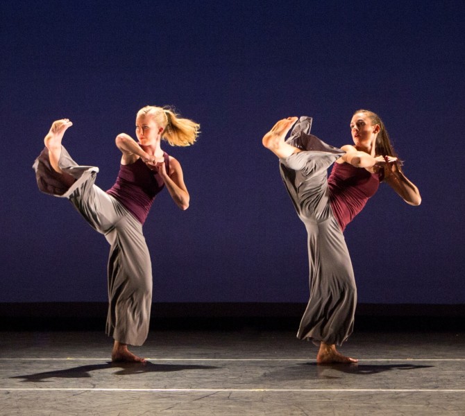 Dancers with their legs raised