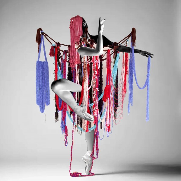 Textile sculpture by Ellie Murphy on ballet dancer arms and legs in red blue purple