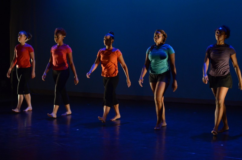 Women dancers of color walking forward