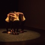 Four women embracing in a circle