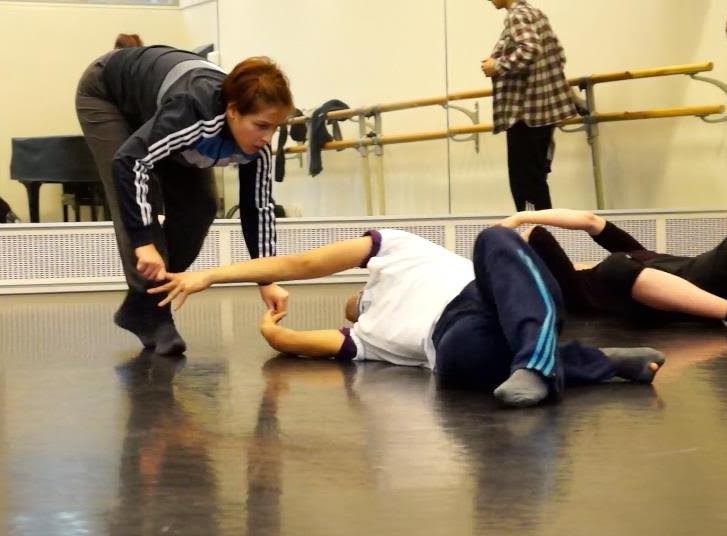 Cristina working with a student in a Flying Low class