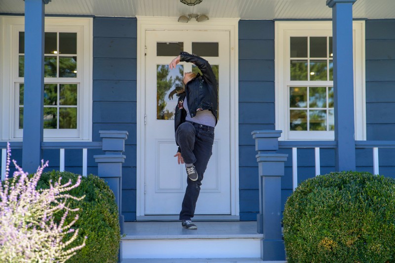Dancer on blue front porch