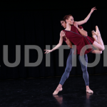 Female dancer lifted by male dancer