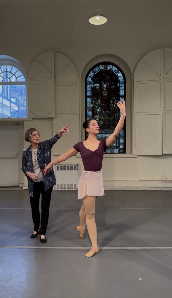 Diana Byer instructing dancer with port de bras