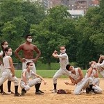 8 dancers, of multicultural backgrounds and gender, together on a baseball field in Central Park, wearing pin striped costumes.