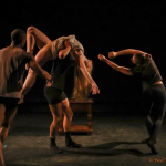 4 dancers on a stage with one of them being lifted 