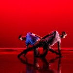 Two Male Dancers with red background