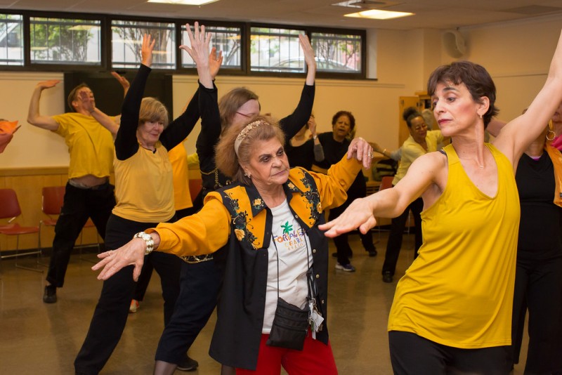 Artistic Director Naomi Goldberg Haas and seniors from Goddard Riverside Senior Center