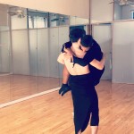 A dancer caring another