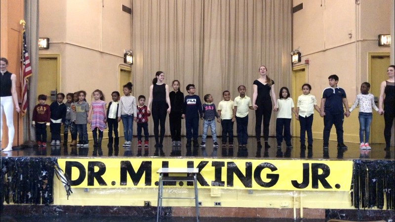 Children on an auditorium stage