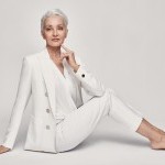 Marie-Christine wearing a white suit