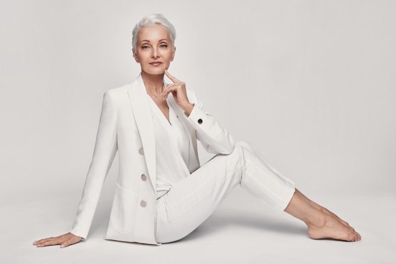 Marie-Christine wearing a white suit