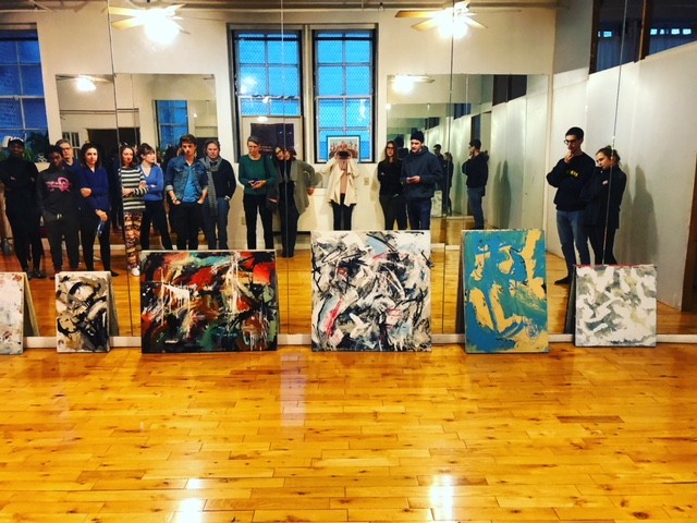 Artists looking at paintings