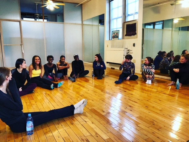 artists sitting in a semi-circle and for Q&A