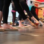 Dancers running through Self-care Practices routine.
