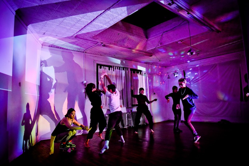 people dancing under psychedelic lights 