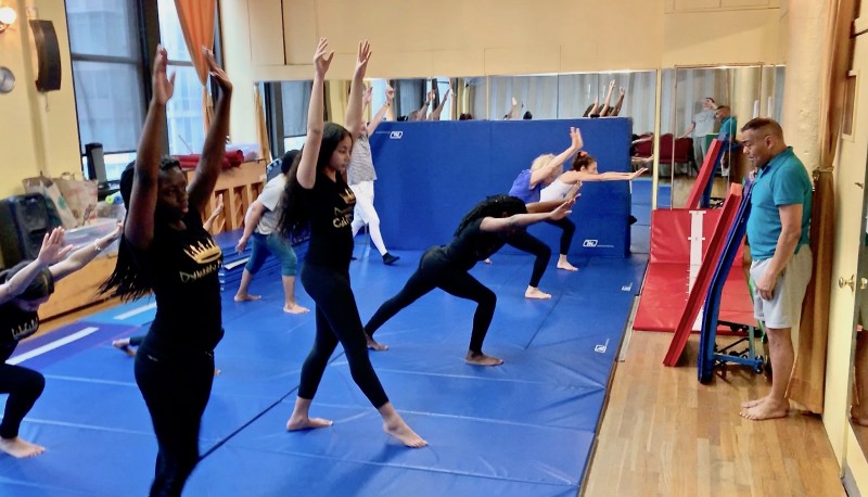 dancers demonstrating kick-up to handstand