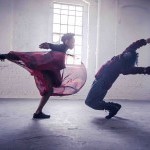 Two dancers; a woman and a man, are in the still image from a dance film incorporating Capoeira, the Brazilian martial art.