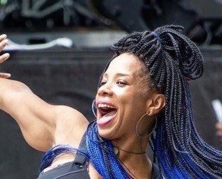 Instructor dancing with arms out