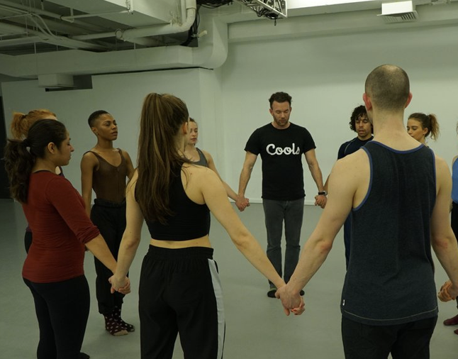 Group of people holding hands