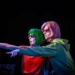 Hannah Garner and Will Noling subtly noticing a friend in the audience at a live show.