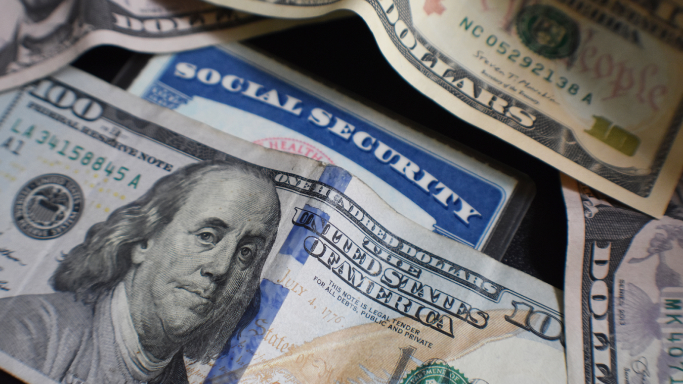 Photo of US dollar bills and social security
